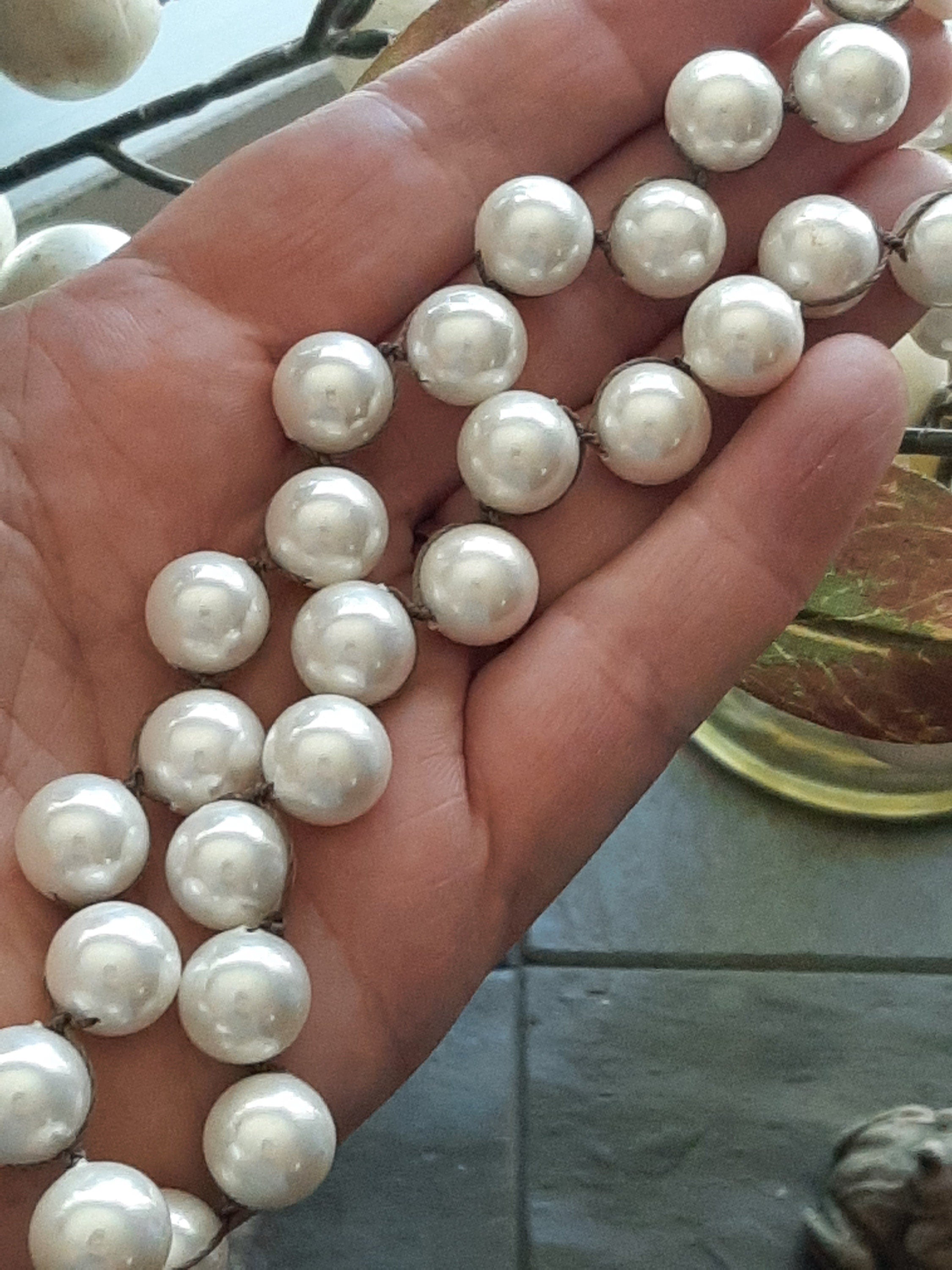 Whimsically knotted pearl necklace